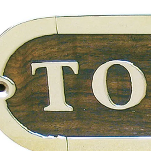 Detailansicht von Türschild TOILETTES